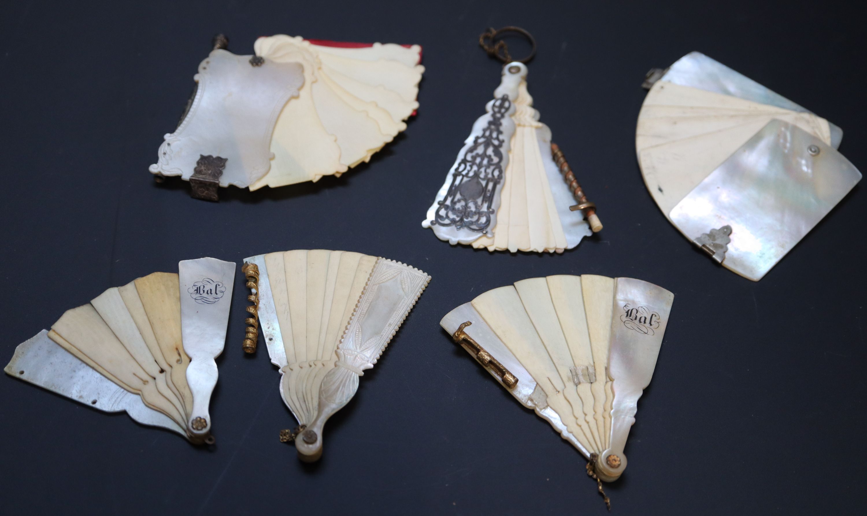 Six 19th century Palais Royale mother of pearl mounted dance cards and note cases largest 9cm